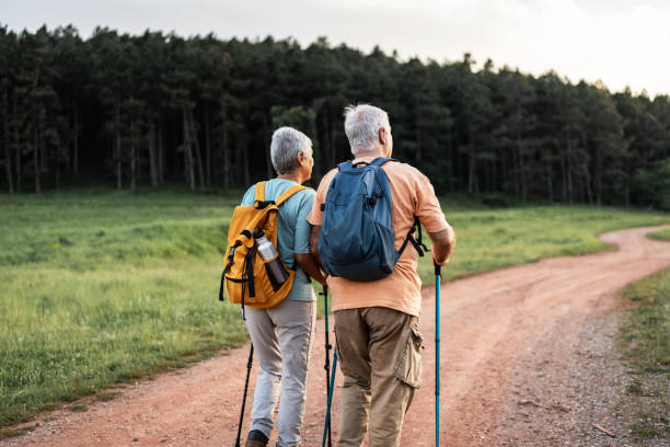istock Senior couple is hiking in forest 2164195204