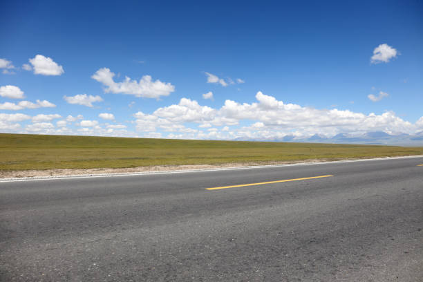 istock High mountain highway, asphalt road, car advertising background, road surface 2164196675