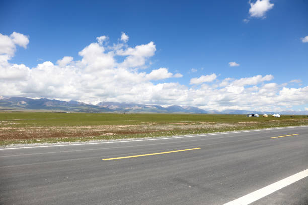 istock High mountain highway, asphalt road, car advertising background, road surface 2164196697
