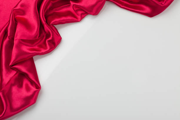 istock A general term for shiny fabric woven with silk thread. Light, elegant in color, and soft to the touch. Background 2164203724
