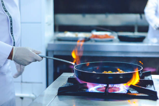 istock Chef Makes Smoky Pan Fried Vegetables 2164206438