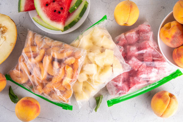 istock Frozen fruit slices in bags, with fresh peaches, watermelon, melon 2164212976