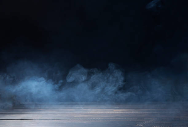 istock Soft focus, wooden floor or table, white mist or smoke on a black background 2164215559