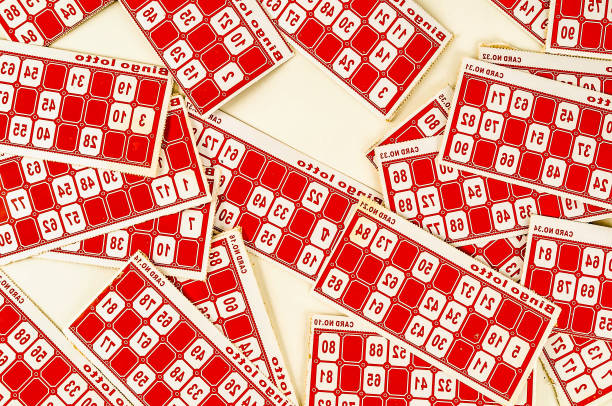 A bunch of red and white numbered tickets