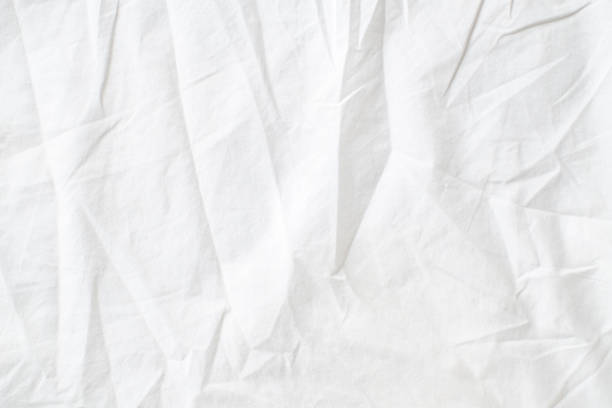 istock Abstract White Bedding Sheets or White wrinkled fabric background texture and Texture with copy-space :Creased or wrinkled white fabric,Soft focus 2164217128