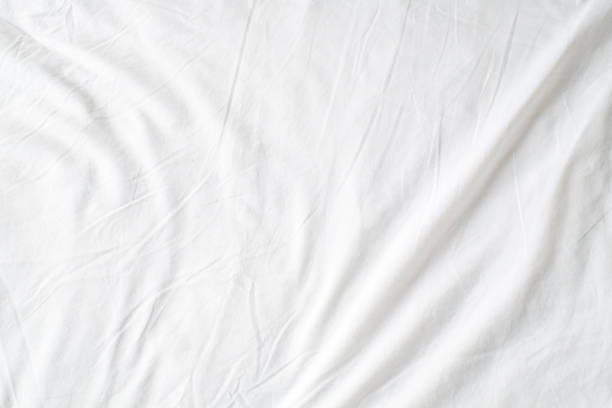 istock Abstract White Bedding Sheets or White wrinkled fabric background texture and Texture with copy-space :Creased or wrinkled white fabric,Soft focus 2164217215