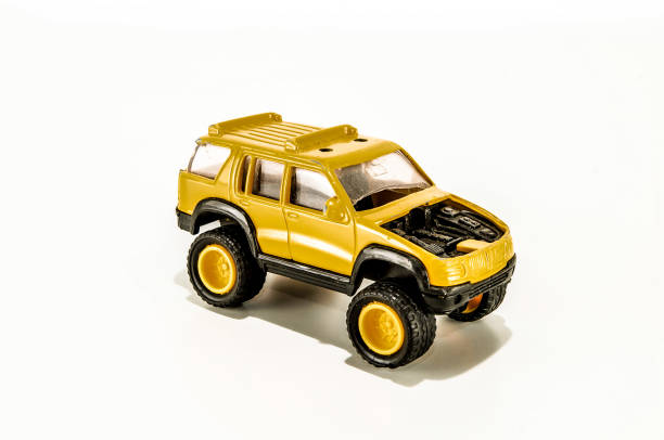 istock A yellow toy car with a black engine 2164224000