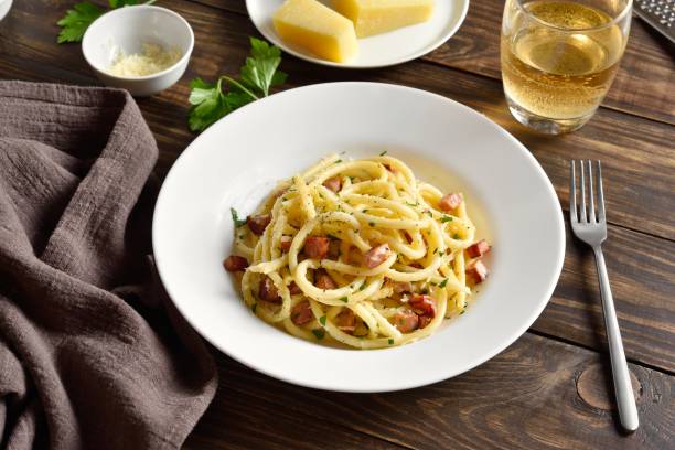 istock Carbonara pasta, spaghetti with crisp pancetta and black pepper 2164224257