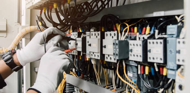 istock Electrician engineer tests electrical installations and wires on relay protection system. 2164227065