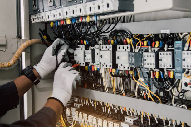 istock Electrician engineer tests electrical installations and wires on relay protection system. 2164227086