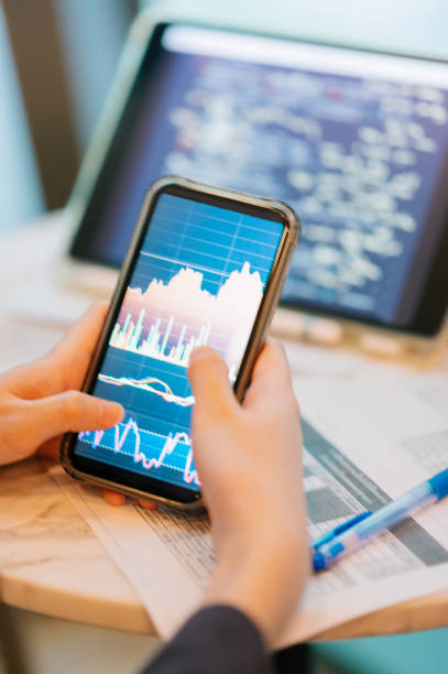 istock Artificial intelligence working with financial consulting person using a digital tablet to view predictive market analytics, integrate with AI, with comprehensive charts 2164227633