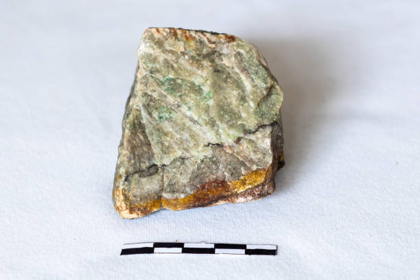 istock Sample of Barite against a white background with a scale 2164230996