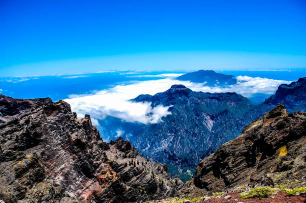 istock The sky is blue and the mountains are covered in clouds 2164234204
