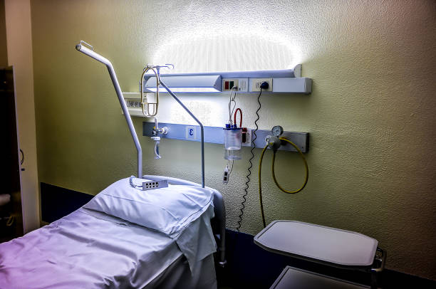 istock A hospital room with a bed and a white curtain 2164234239