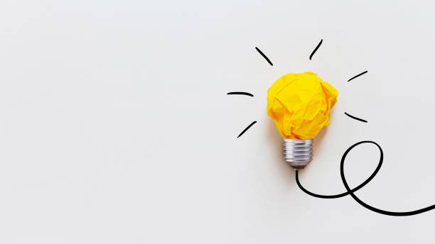 istock Yellow crumpled paper light bulb drawn on a white background. Brainstorm and creative idea, concept. Project and startup. Business and growth 2164236210