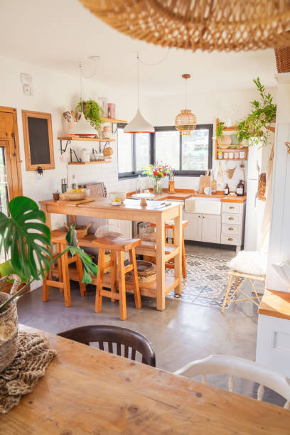 istock Country kitchen, rustic style. Breakfast area and wooden benches. Wicker lamp. Kitchen accessories 2164237163
