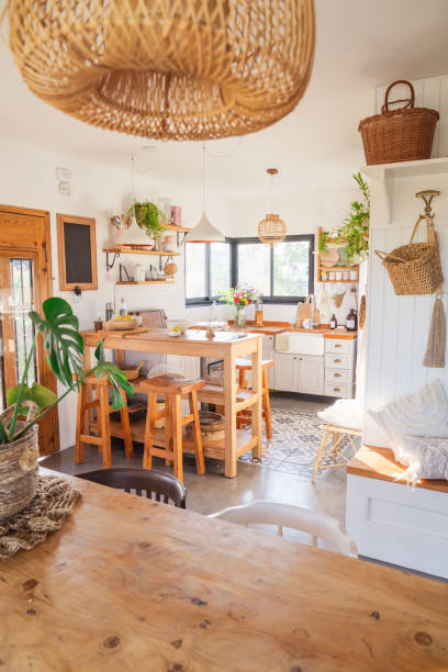 istock Country kitchen, rustic style. Breakfast area and wooden benches. Wicker lamp. Kitchen accessories 2164237164