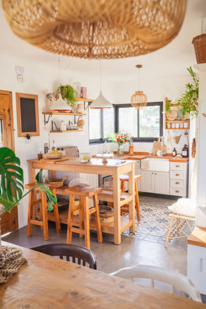 istock Country kitchen, rustic style. Breakfast area and wooden benches. Wicker lamp. Kitchen accessories 2164237165