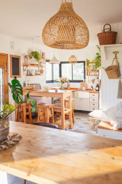 istock Country kitchen, rustic style. Breakfast area and wooden benches. Wicker lamp. Kitchen accessories 2164237166