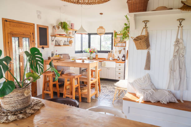 istock Country kitchen, rustic style. Breakfast area and wooden benches. Wicker lamp. Kitchen accessories 2164237193