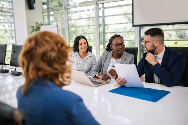 istock Human resource having a pleasant talk with a young female applicant in a relaxed atmosphere during an interview for a job. 2164240193