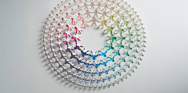 istock Colorful Human Paper Chain Artwork in Concentric Circles Displaying Unity and Diversity in Design 2164240563