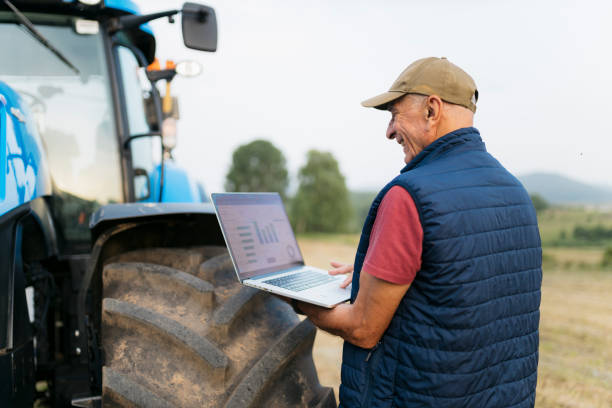 istock Senior male farmer analyzing data on laptop on farmland 2164243045