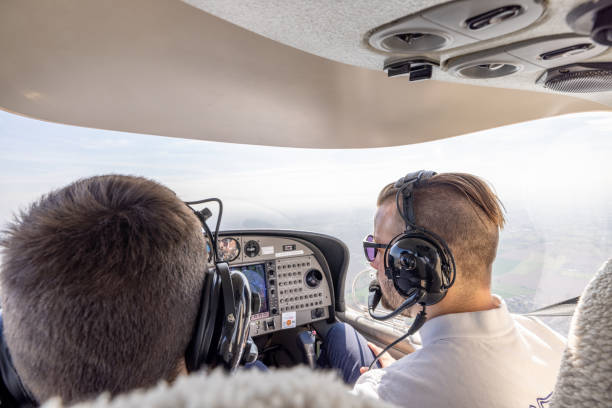 istock Pilots in Cockpit Flying Light Aircraft 2164249575