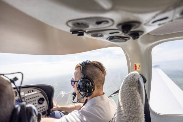 istock Pilots in Cockpit Flying Light Aircraft 2164249604