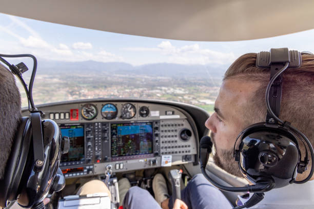 istock Pilots Collaborating in Small Aircraft Cockpit 2164249894