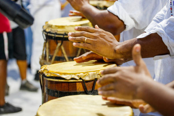 istock people playing tambourine outdoors in Rio de Janeiro. 2164250058