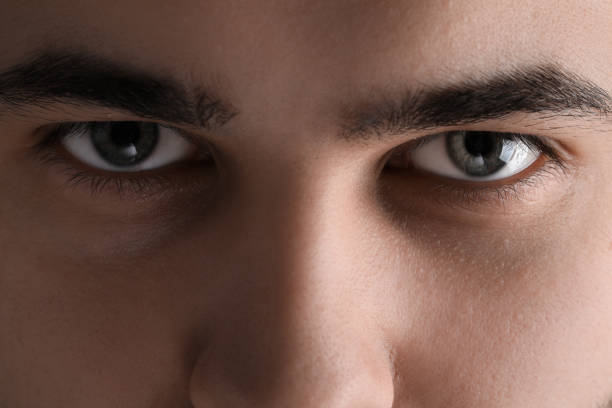 istock Evil eye. Man with scary eyes, closeup 2164250589