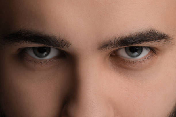 istock Evil eye. Man with scary eyes, closeup 2164250591