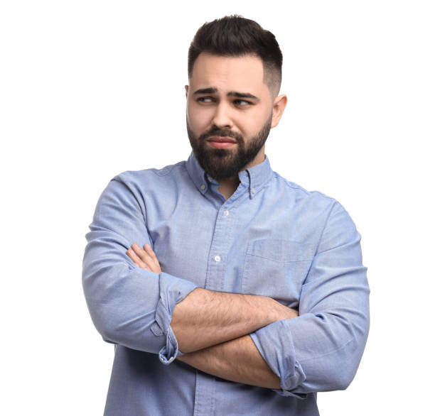 istock Portrait of sad man with crossed arms on white background 2164250708