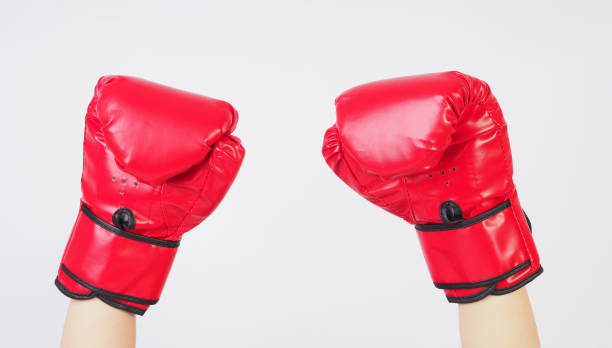 istock Hands wear red Boxing gloves on white background. 2164255158