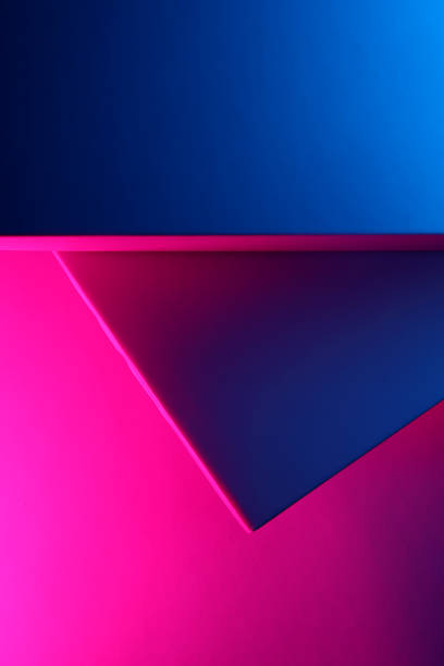 istock Geometrical shaped papers under neon lights 2164255741