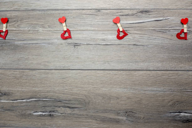 Hearts on wooden background