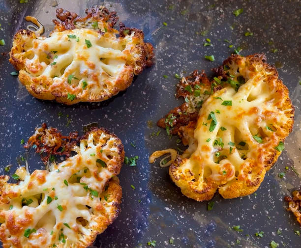 istock Cauliflower or broccoli in the process of roasting. Close-up 2164258064