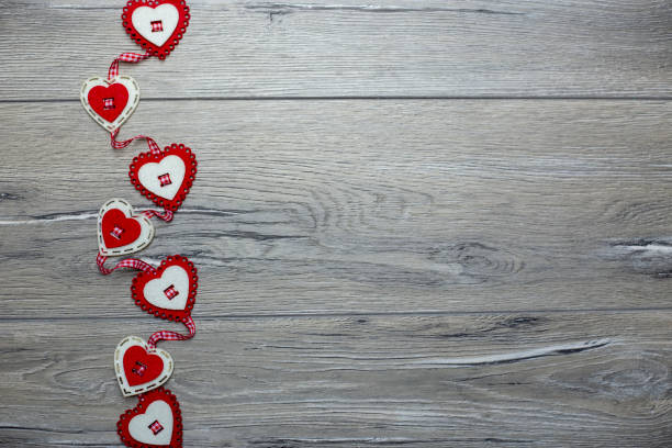 Hearts on wooden background