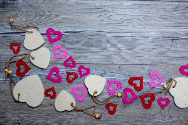 Hearts on wooden background