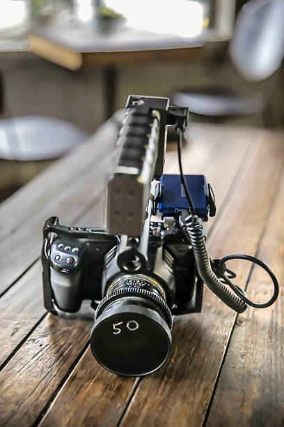 istock professional camera on a wooden table vintage style 2164258654