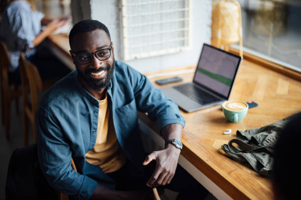 istock Man Working In Cozy Cafe With Laptop And Coffee 2164260775