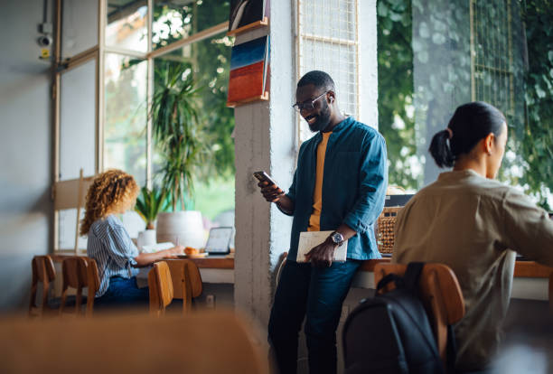 istock People Working and Socializing in a Cozy Cafe Environment 2164260797