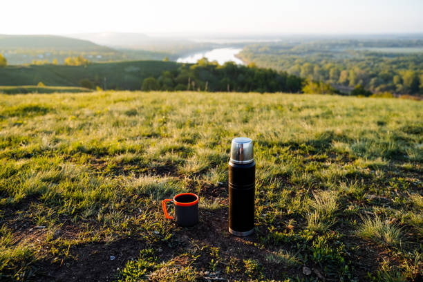 istock Morning Coffee Outdoors Thermos and Cup on Scenic Hillside 2164260986