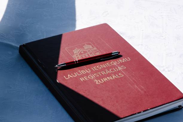 istock Wedding Registration Book with Pen on Table 2164263544