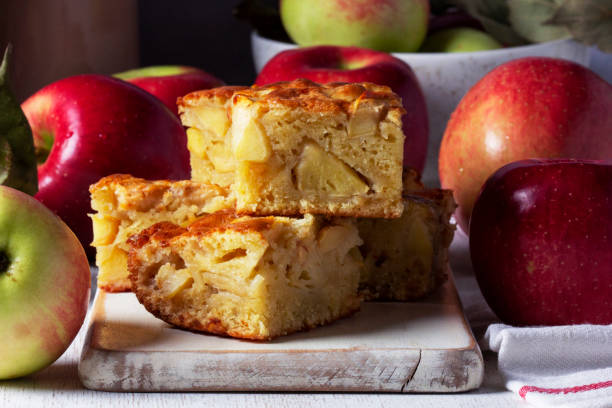 istock Apple pie, apples and teapot served for tea. Traditional apple dessert. 2164265564