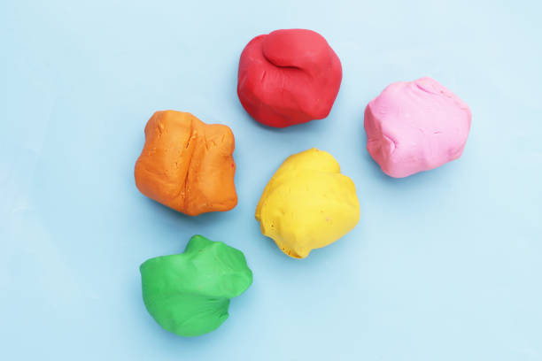 istock Colorful plasticine clay on blue background. 2164267448