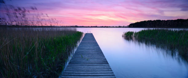 istock Lake with Wooden Pier at Sunset 2164267655