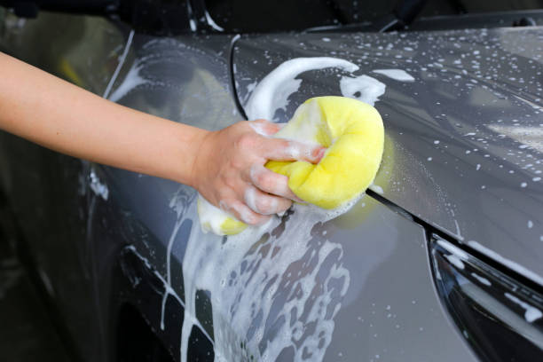 istock Washing car with yellow sponge 2164271962