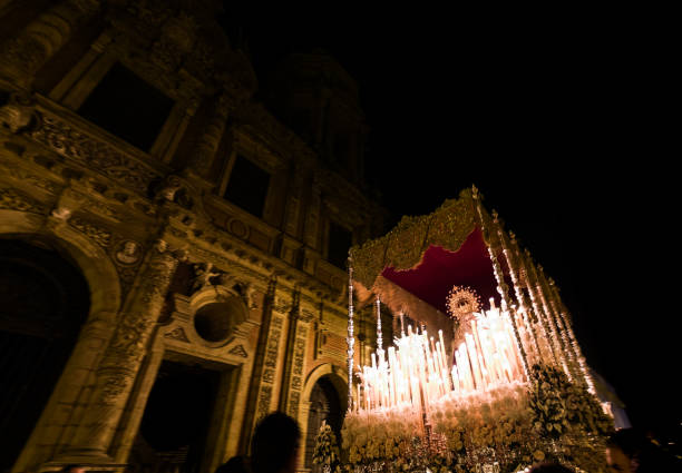 The Virgen de la Aurora passing by the Baroque facade of San Luis de los Franceses during Easter Sunday night.